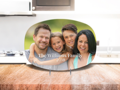 Family photo plaque on a kitchen counter with 'The Williams Family 2018' text.