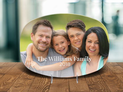 Family photo plaque with 'The Williams Family 2018' on a wooden surface