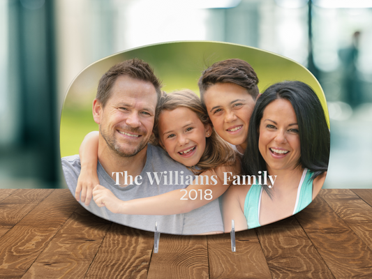Family photo plaque with 'The Williams Family 2018' on a wooden surface