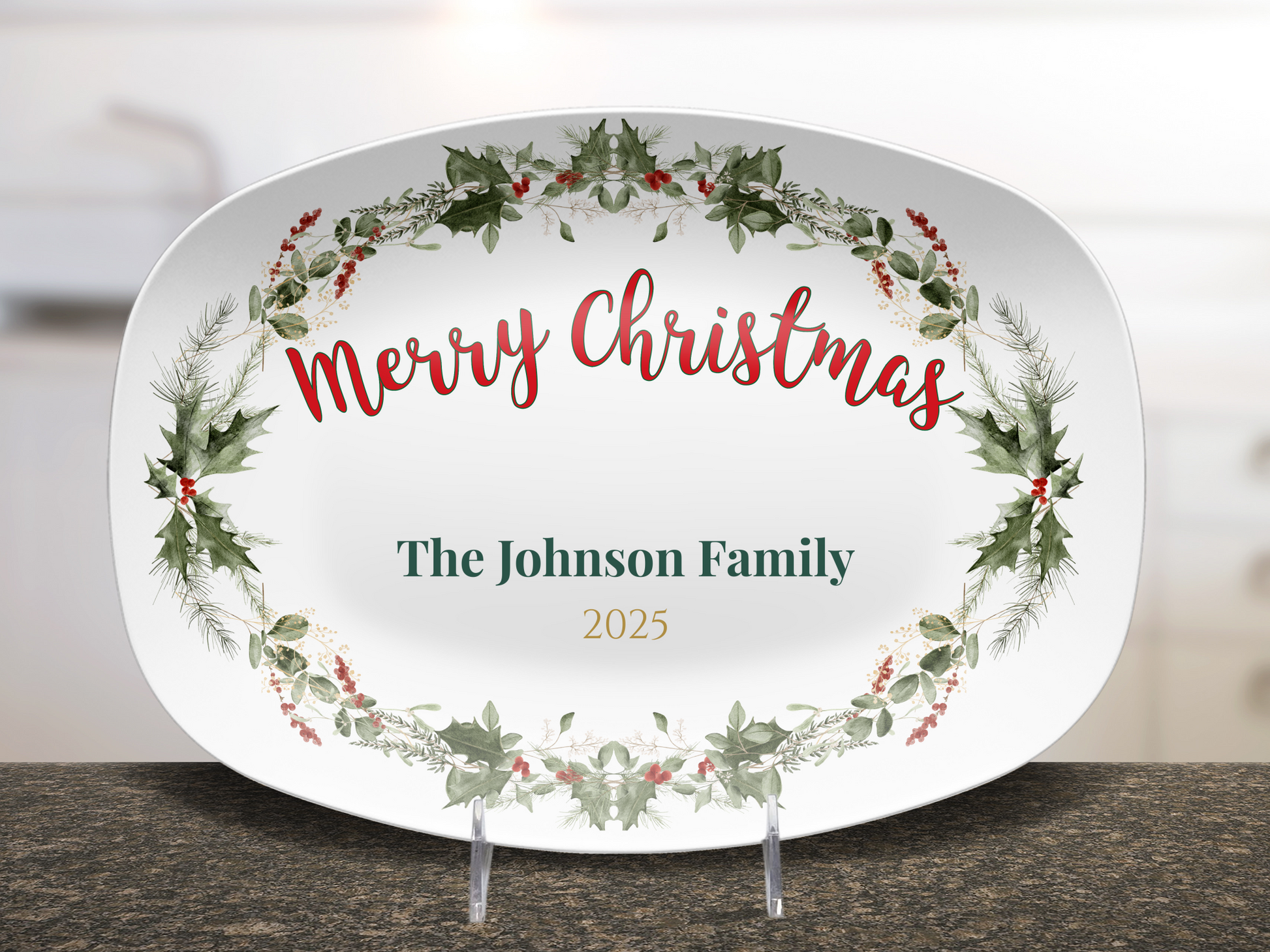 Decorative Christmas serving platter with wreath design and text on a kitchen counter.