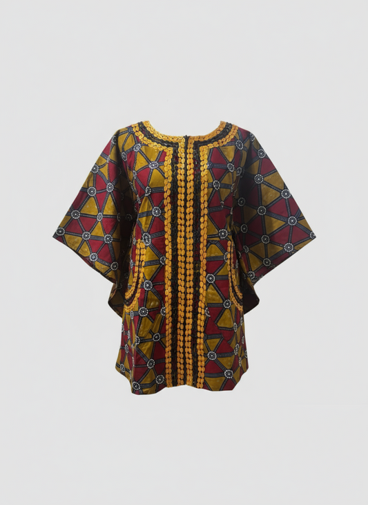 Colorful patterned kaftan on a light gray background
