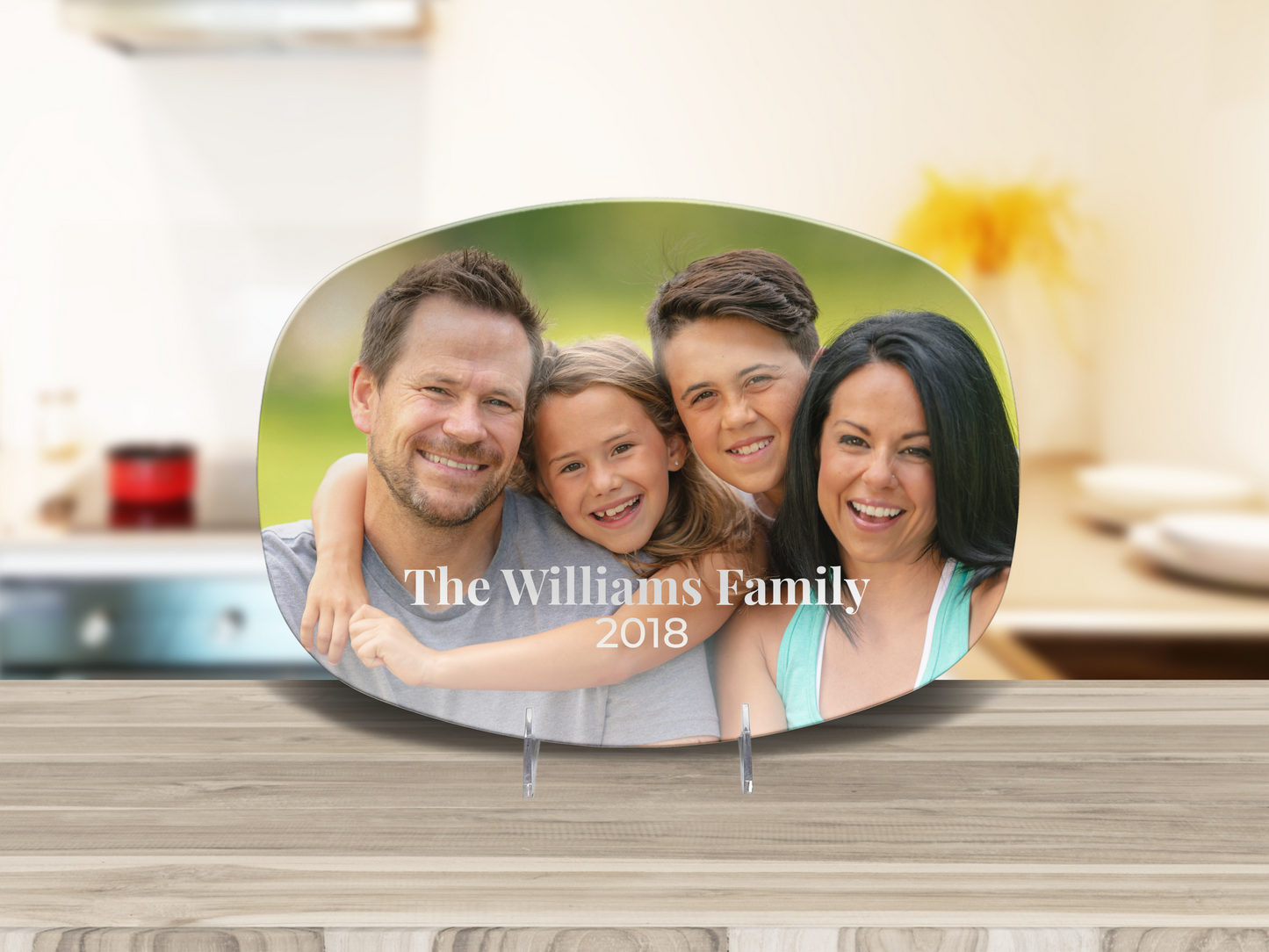 Family photo plaque with 'The Williams Family 2018' on a kitchen counter.