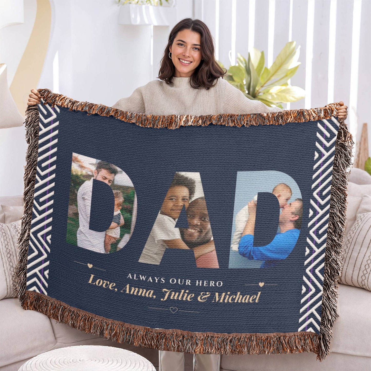 Person holding a personalized blanket with photos of a family and text.