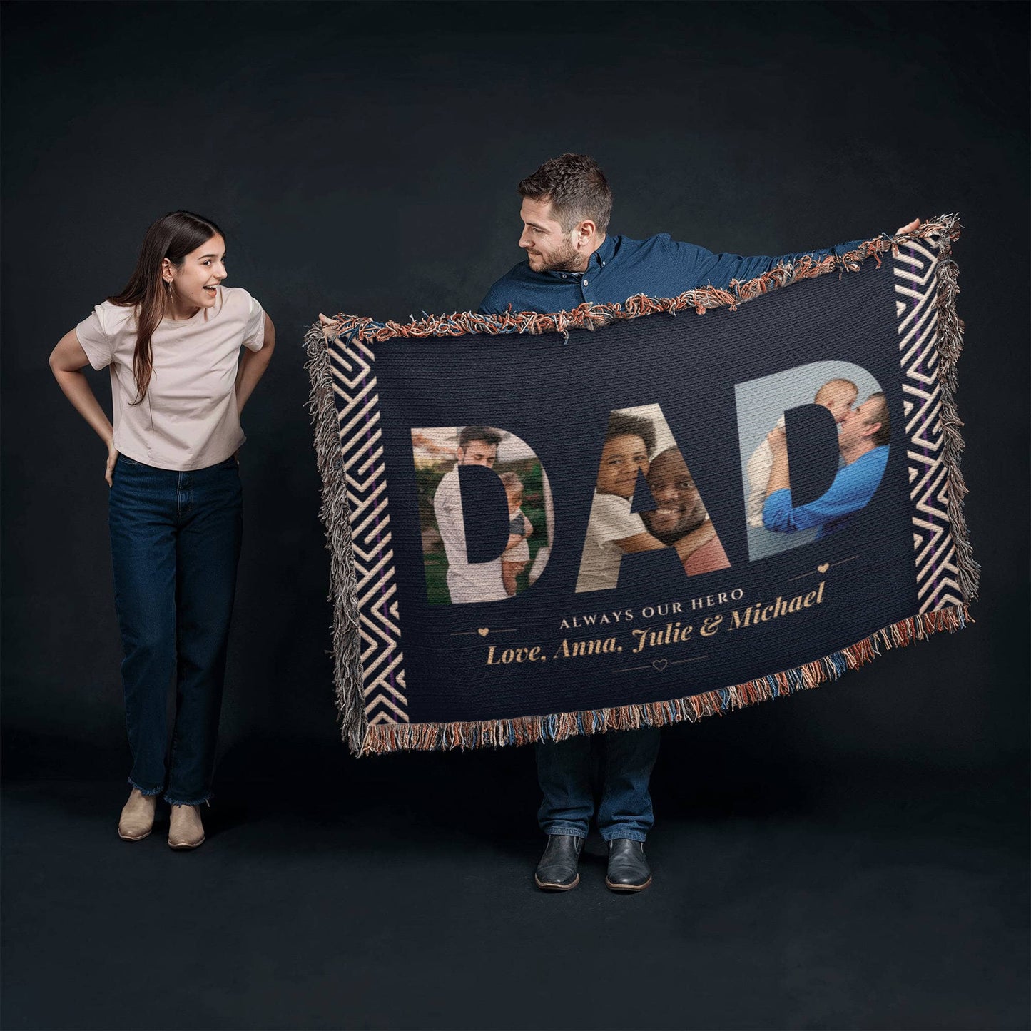 Person holding a personalized blanket with family photos and text on a dark background